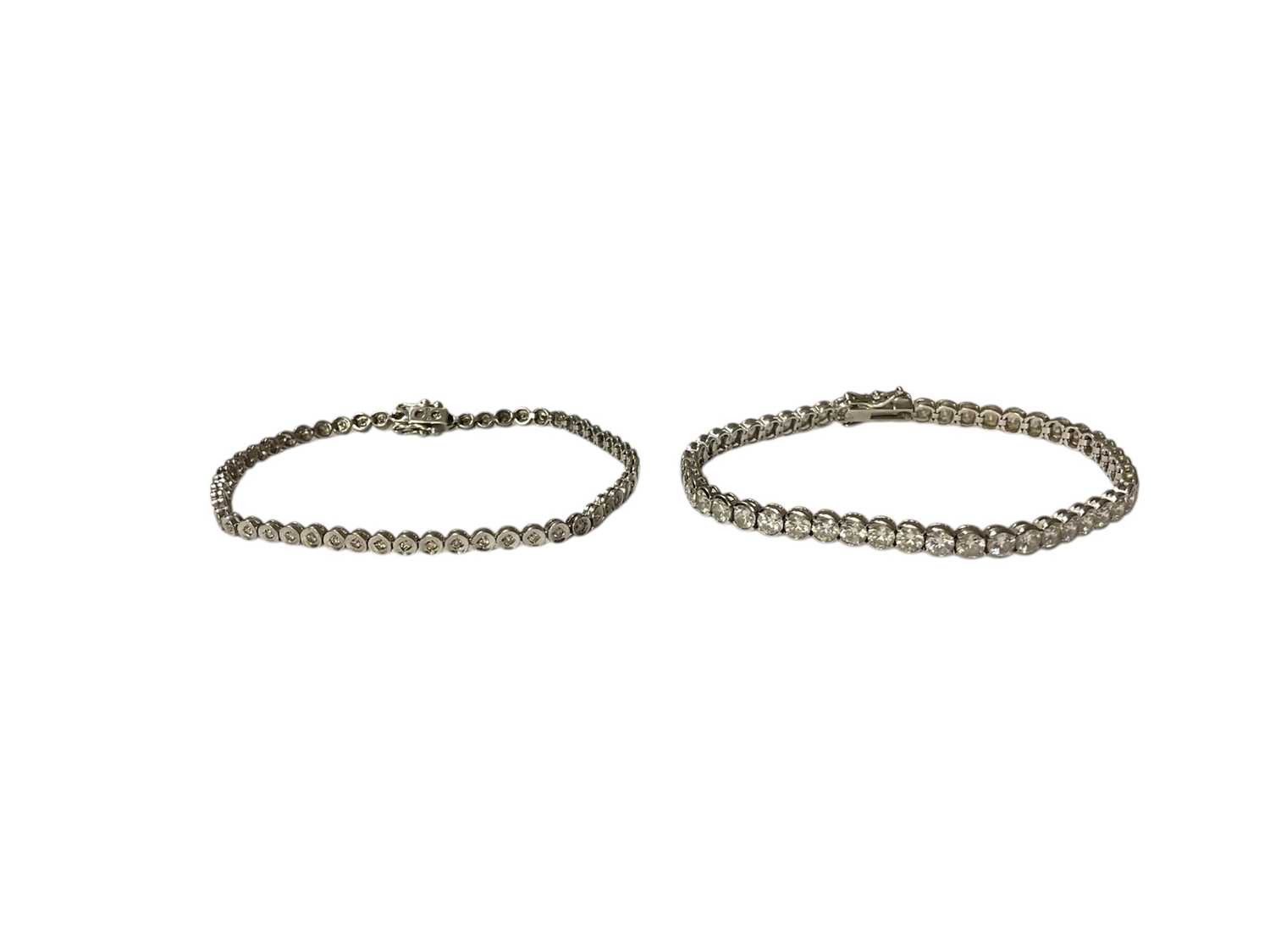 Lot 48 - 9ct white gold diamond set tennis bracelet and 9ct white gold synthetic white stone tennis bracelet (2)
