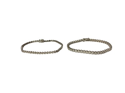 Lot 48 - 9ct white gold diamond set tennis bracelet and 9ct white gold synthetic white stone tennis bracelet (2)