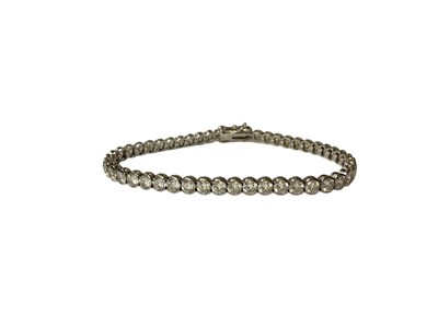 Lot 48 - 9ct white gold diamond set tennis bracelet and 9ct white gold synthetic white stone tennis bracelet (2)