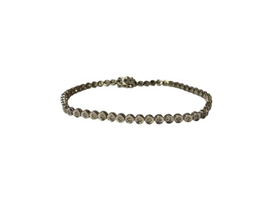 Lot 48 - 9ct white gold diamond set tennis bracelet and 9ct white gold synthetic white stone tennis bracelet (2)