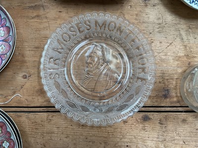 Lot 27 - Campbell, Jones and co. (attributed), a Victorian commemorative pressed glass plate for Sir Moses Montefiore, moulded with a central profile bust. Montefiore a Jewish philanthropist and banker,...