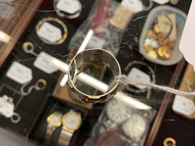 Lot 117 - Modernist silver thick band ring with applied yellow metal square and dot decoration (Dublin 2000)