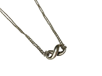 Lot 119 - Tiffany & Co. silver infinity pendant on original silver double cable link chain