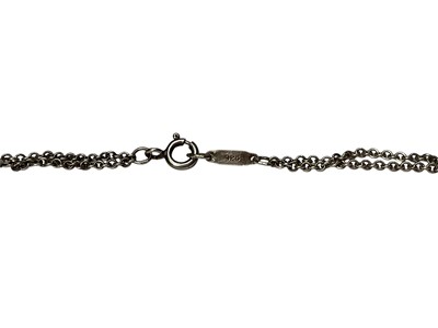 Lot 119 - Tiffany & Co. silver infinity pendant on original silver double cable link chain