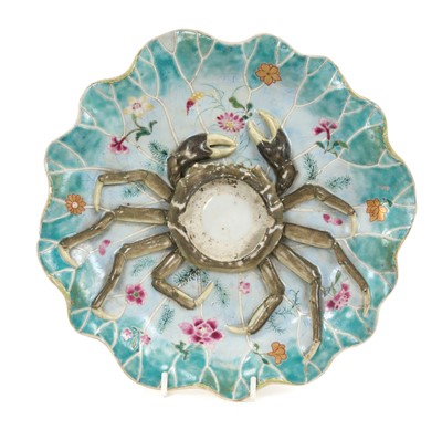 Lot 60 - 18th century Qianlong Period Chinese export porcelain Mancerina (cup stand) with a moulded crab in relief on a turquoise edged lotus leaf decorated with seaweed and flowers raised on a circular...