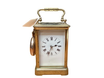 Lot 2412 - Brass carriage clock together with a Waltham pocket watch