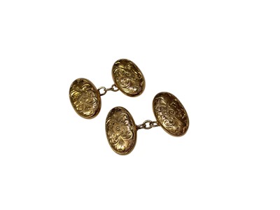 Lot 61 - Pair of antique 9ct gold cufflinks, the oval panels with engraved floral scroll decoration (Birmingham 1919)