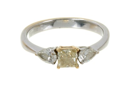 Lot 590 - Diamond three stone ring with a central princess cut yellow diamond flanked by two pear cut diamonds
