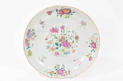 Lot 161 - 18th century Chinese porcelain dish with scalloped edge, decorated in the famille rose palette, 25cm in diameter.