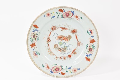 Lot 162 - 18th century Chinese porcelain charger decorated with dogs, 32cm in diameter.