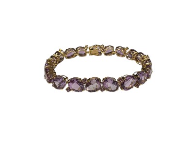 Lot 108 - 9ct gold amethyst bracelet with a row of 19 oval mixed cut amethysts interspaced with further round mixed amethysts, 19cm long