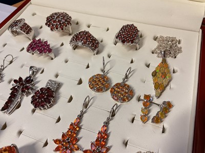 Lot 76 - Group of Gemporia silver garnet and other gem set dress rings, earrings and pendants in a fitted ring display case