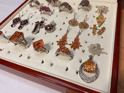 Lot 76 - Group of Gemporia silver garnet and other gem set dress rings, earrings and pendants in a fitted ring display case