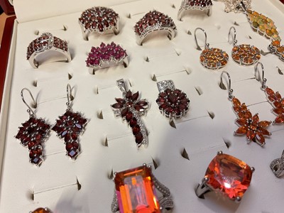 Lot 76 - Group of Gemporia silver garnet and other gem set dress rings, earrings and pendants in a fitted ring display case