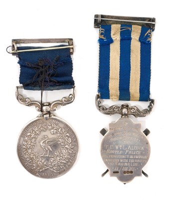 Lot 17 - Family pair to Father and Son comprising- Liverpool Shipwreck and Humane Society's Marine medal, (silver issue), EF, named to William L. Alcock. For Gallant Service. 3/9/1947 and Liverpool Shipw...