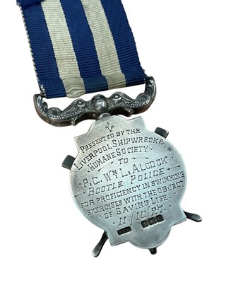 Lot 17 - Family pair to Father and Son comprising- Liverpool Shipwreck and Humane Society's Marine medal, (silver issue), EF, named to William L. Alcock. For Gallant Service. 3/9/1947 and Liverpool Shipw...