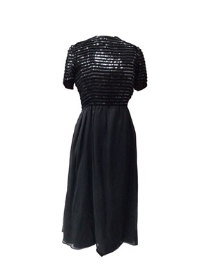 Lot 2116 - 1970s Givenchy Nouvelle Boutique black cocktail dress, black chiffon skirt and velvet and sequin bodice and sleeves.
