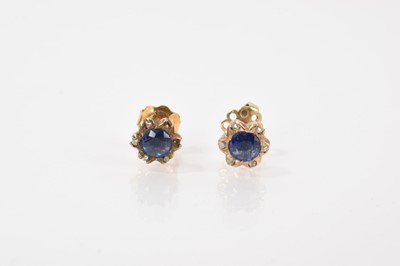 Lot 654 - Pair of antique sapphire and diamond flower head earrings