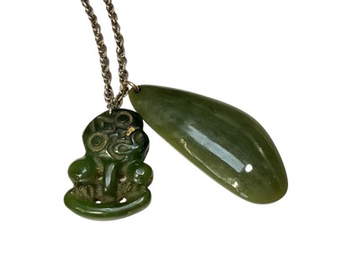 Lot 106 - Māori green hardstone tiki pendant and another green hardstone pendant on a silver chain, together with other similar pendants
