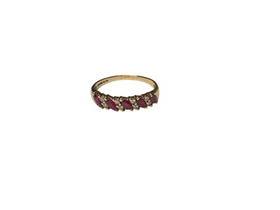 Lot 156 - 9ct gold ruby and diamond half eternity ring