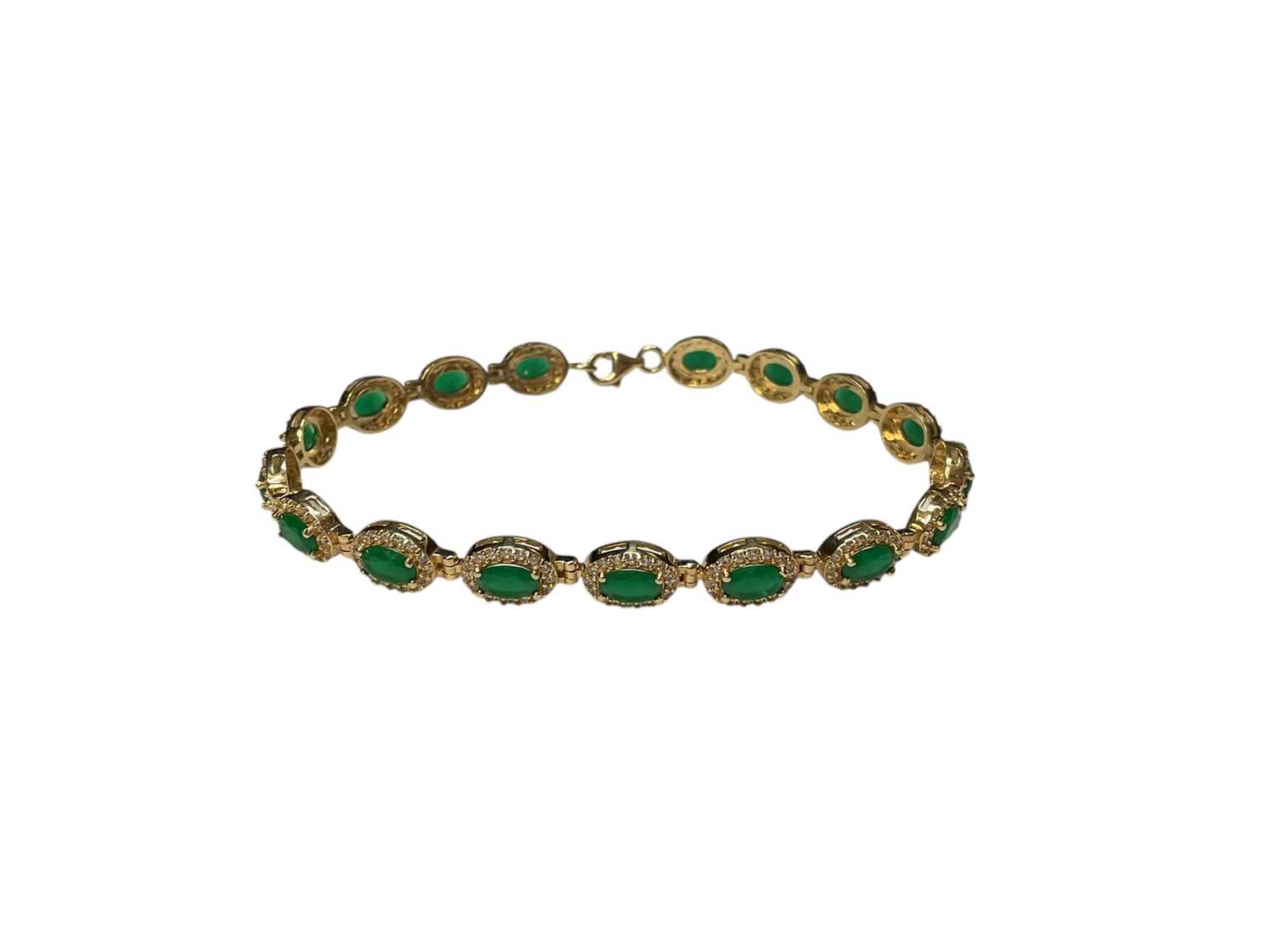 Lot 109 - Gold emerald and synthetic white stone cluster bracelet