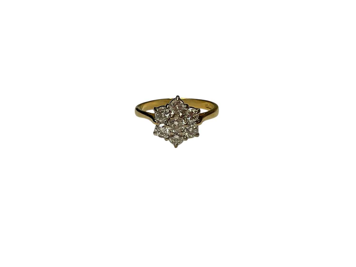 Lot 111 - 18ct gold diamond flower head cluster ring