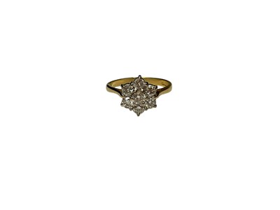 Lot 111 - 18ct gold diamond flower head cluster ring