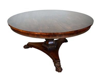 Lot 1442 - William IV rosewood breakfast table with circular tilt-top, hexagonal column and trefoil base with paw feet, 137cm diameter
