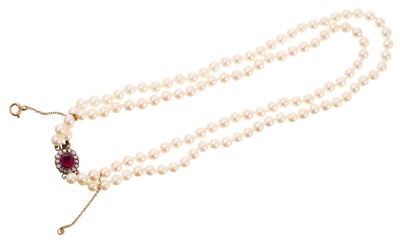 Lot 488 - Cultured pearl two-strand necklace on an antique ruby and diamond cluster clasp
