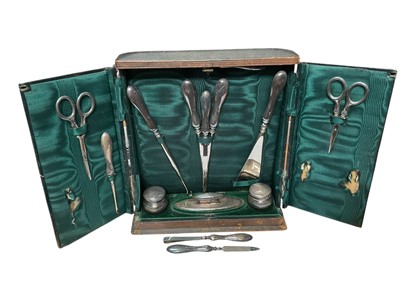 Lot 150 - Early 20th century silver dressing table/manicure set in original fitted leather case