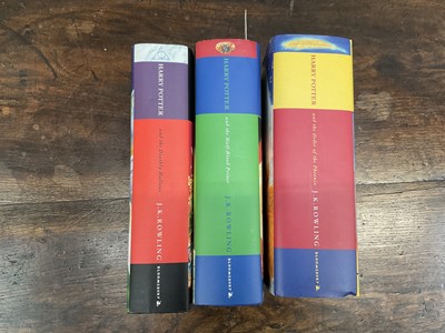 Lot 1689 - Three First Edition Harry Potter books to include the Half-Blood Prince with rare page 99 printing error with the misprint 'eleven owls'. Order of The Phoenix and Deathly Hallows. (3)