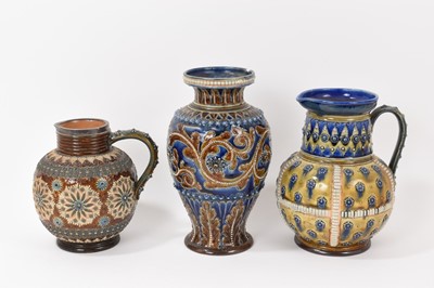 Lot 88 - Victorian Doulton baluster vase, probably by George Tinworth, and two similar Doulton jugs