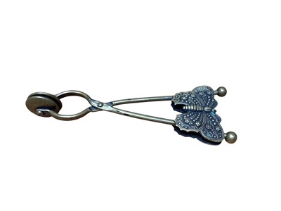 Lot 2422 - 19th century brass butterfly skirt lifter, with patent mark, dated 1876