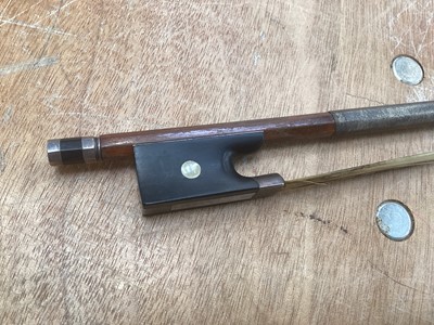 Lot 2209 - Antique violin in case, two-piece back measuring 35.75cm, with two bows, one marked Tourte(?)
