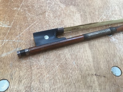 Lot 2209 - Antique violin in case, two-piece back measuring 35.75cm, with two bows, one marked Tourte(?)