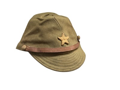 Lot 707 - Second World War Japanese Army field service cap with applied star badge and leather band.