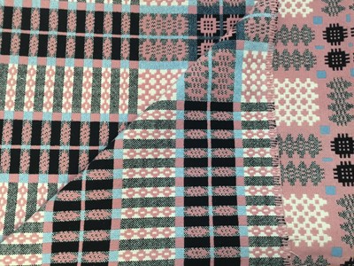 Lot 2136 - 1960s Gilmore's Welsh pattern woven wool blanket in pink blue black and cream. 220 x 220cms approximately.