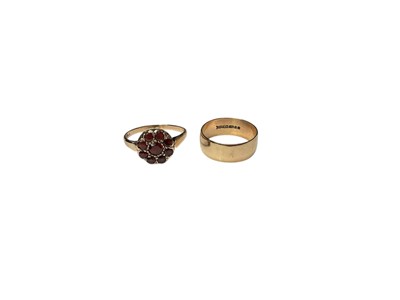 Lot 157 - 9ct gold garnet flower head cluster ring and 9ct gold thick band wedding ring (2)
