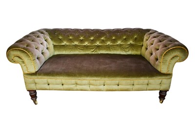 Lot 1432 - Victorian chesterfield sofa with buttoned green velvet upholstery on turned and reeded mahogany feet with large brass wheel casters