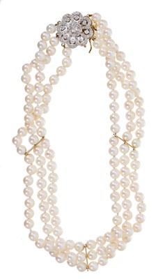 Lot 565 - Cultured pearl and diamond choker with a triple strand of 5.8mm cultured pearls on a diamond cluster clasp