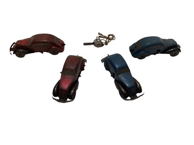Lot 1937 - Tinplate racing track with four clockwork cars and tinplate clockwork roller (1 box)