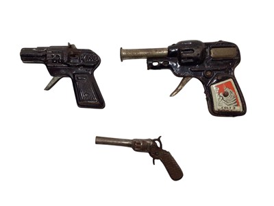 Lot 1942 - Three tinplate toy pistols (3)