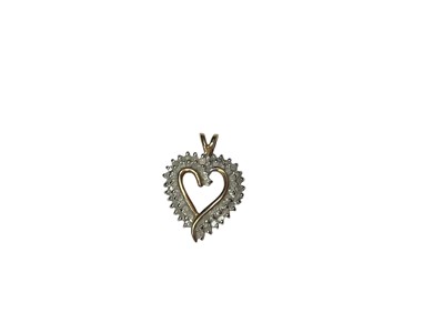 Lot 194 - Gold (stamped 10K) diamond set heart shaped pendant, 25mm long
