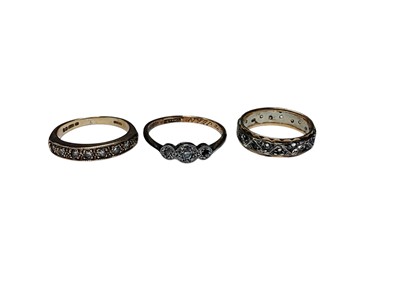 Lot 159 - 9ct gold diamond set half eternity ring, one other 9ct gold diamond set ring and a yellow metal synthetic stone eternity ring (3)