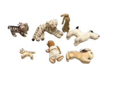 Lot 1971 - Group of mohair soft toys including Huntsman Fox, rabbits, kittens etc, some jointed some swivel heads, some possibly Steiff. Plush small suede push-a-long giraffe, metal wheels.