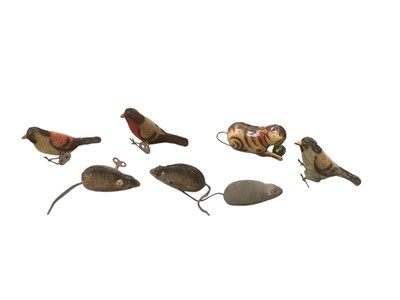 Lot 1974 - Three Schuco clockwork mohair birds and three clockwork mice, tinplate clockwork cat and ball.
