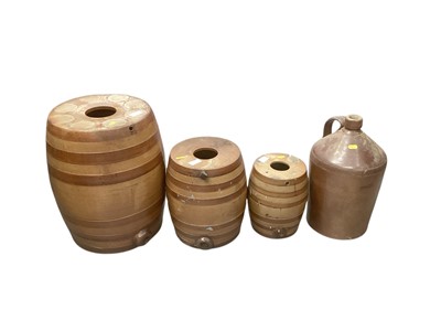 Lot 863 - Set of 3 graduated Doulton Lambeth stoneware barrels along with a stoneware pitcher