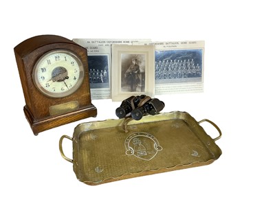 Lot 756 - Late Victorian oak cased mantel clock with applied brass presentation plaque 'Robert Wardle 1st Vol. Battn. Border Regt.' 1892, brass trench art tray, binoculars, and photographs (1 box).