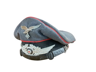 Lot 745 - Second World War Nazi Luftwaffe Officers Cap with red piping and brown leather head band to interior, bearing faded ink stamp and date- 1939, brim of hat missing.