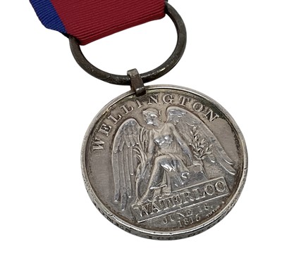 Lot 25 - Waterloo medal named to William Jones 16th or Queen's Light Drag. Together with some printed research.